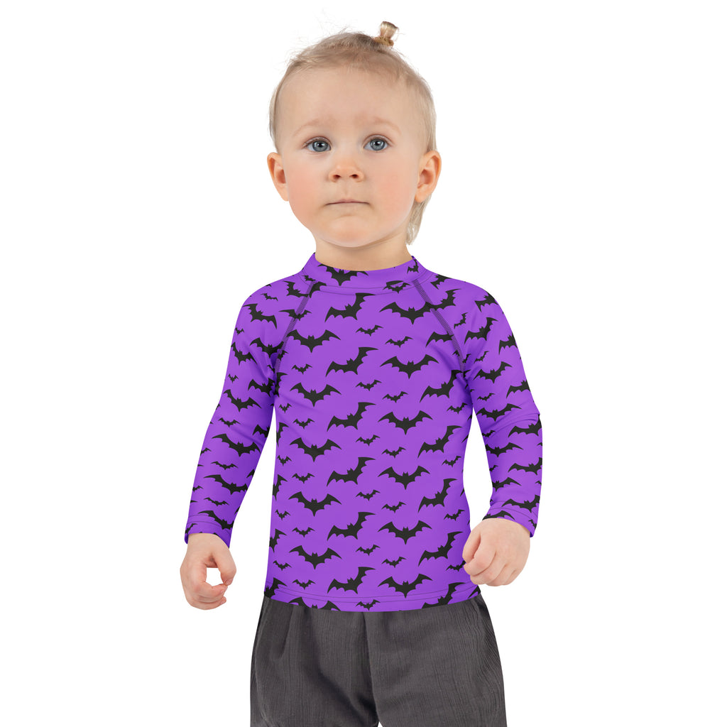 Kids purple long sleeve rash guard swim shirt with black bat patterns and upf 50 plus for halloween protection