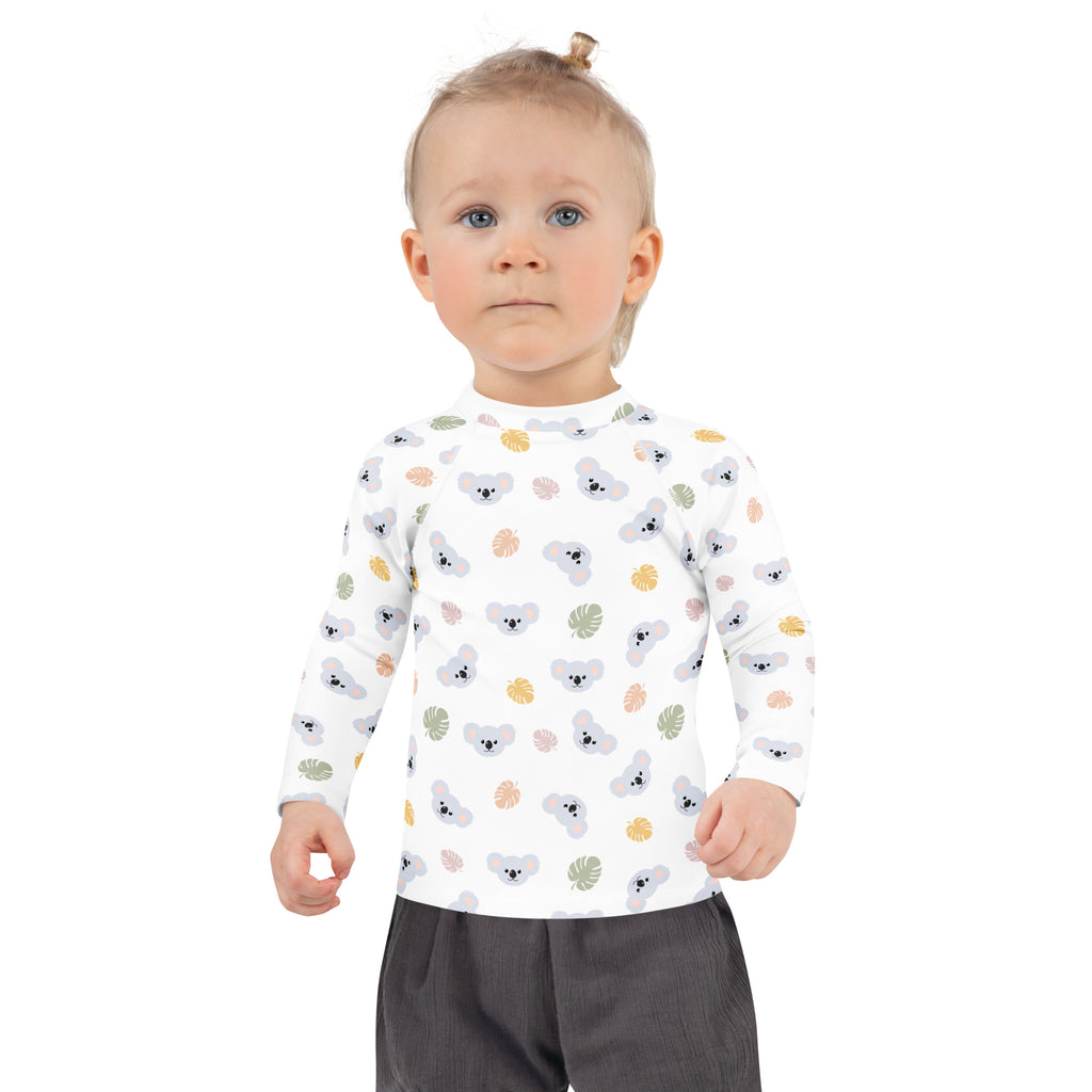 White long-sleeved kids koala bear rash guard swim shirt with colorful tropical leaves and upf 50+ protection