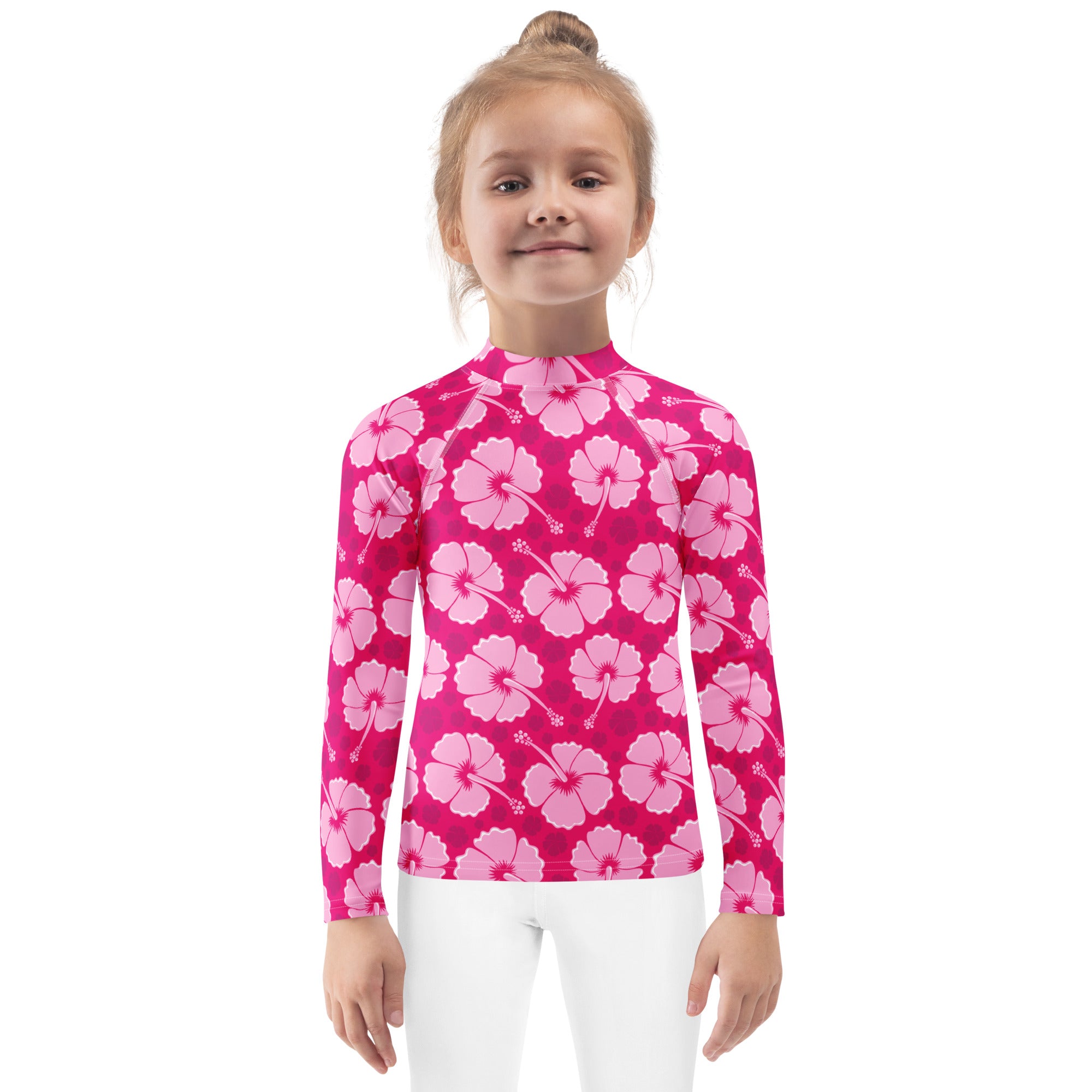 Girls tropical pink hibiscus long sleeve rash guard swim shirt with upf 50 plus featuring a vibrant hibiscus pattern