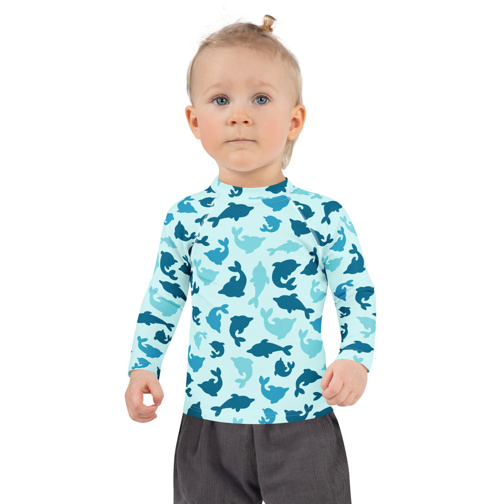 Kids blue dolphin long sleeve rash guard swim shirt with upf 50 plus featuring a playful pattern of blue whales