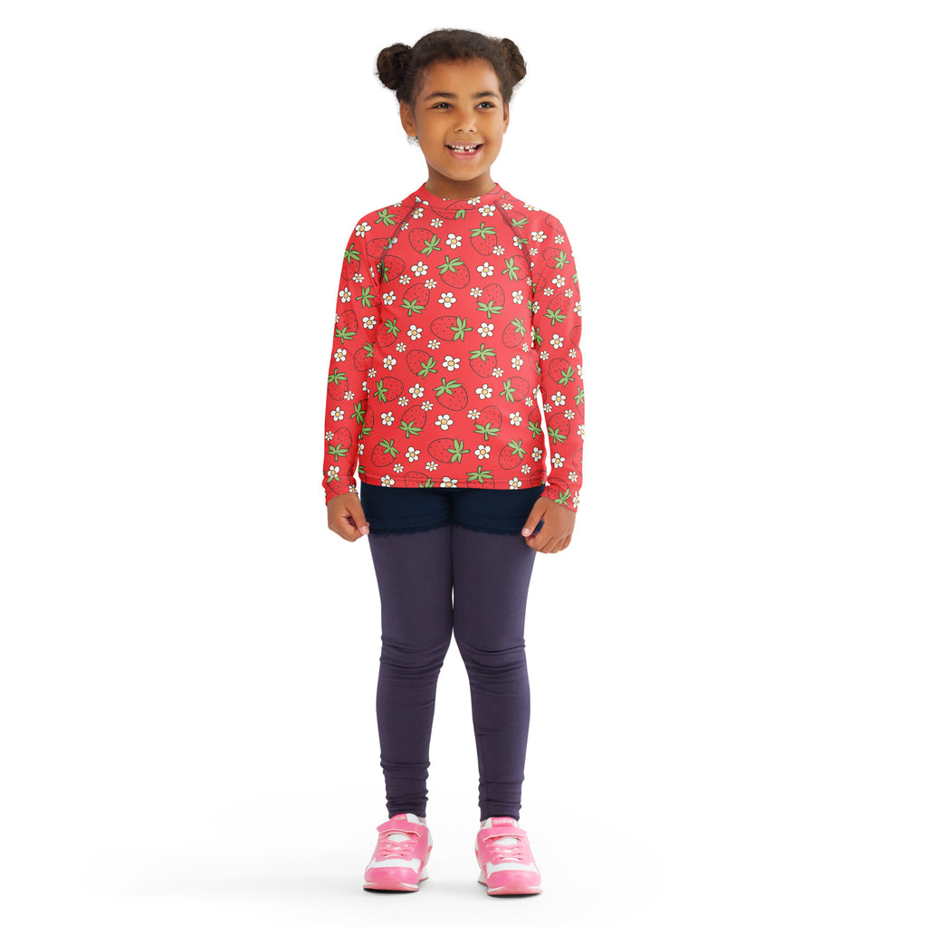 Kids red long sleeve rash guard swim shirt with upf 50 plus featuring strawberry and white flower pattern worn by child