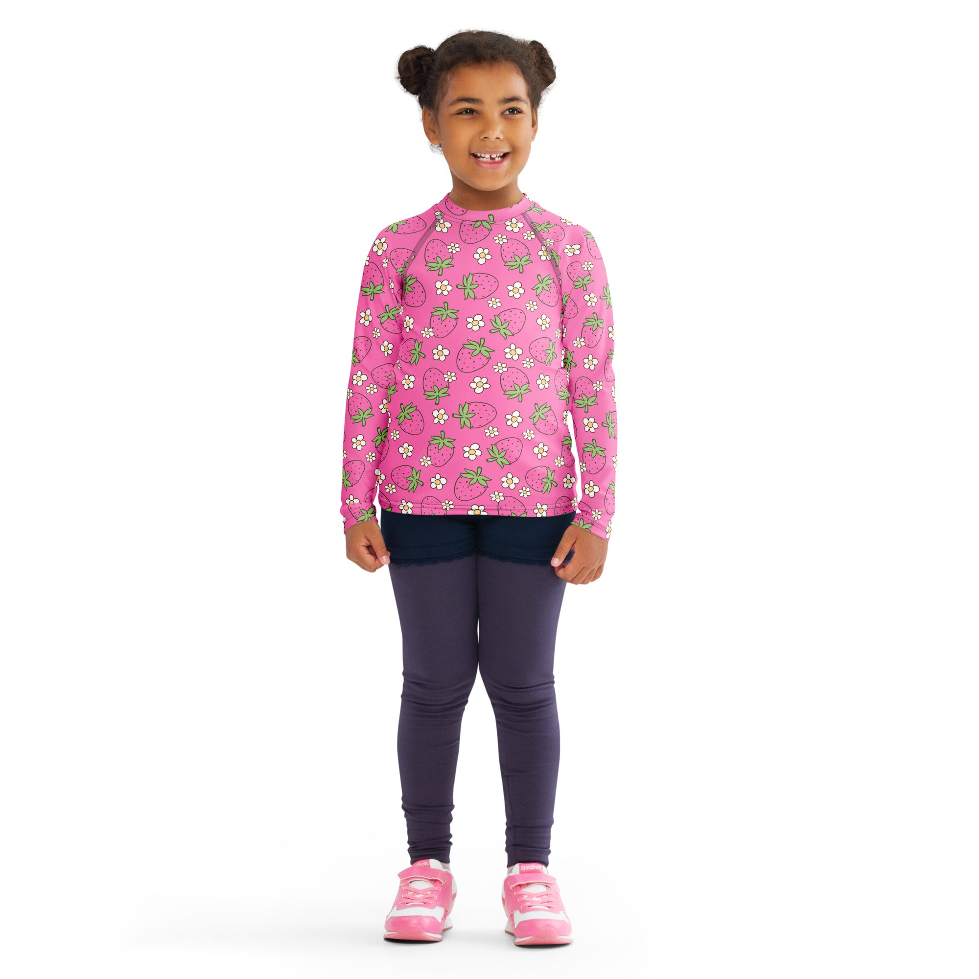 Girls pink long sleeve rash guard swim shirt with strawberry and white flower pattern and UPF 50 plus protection