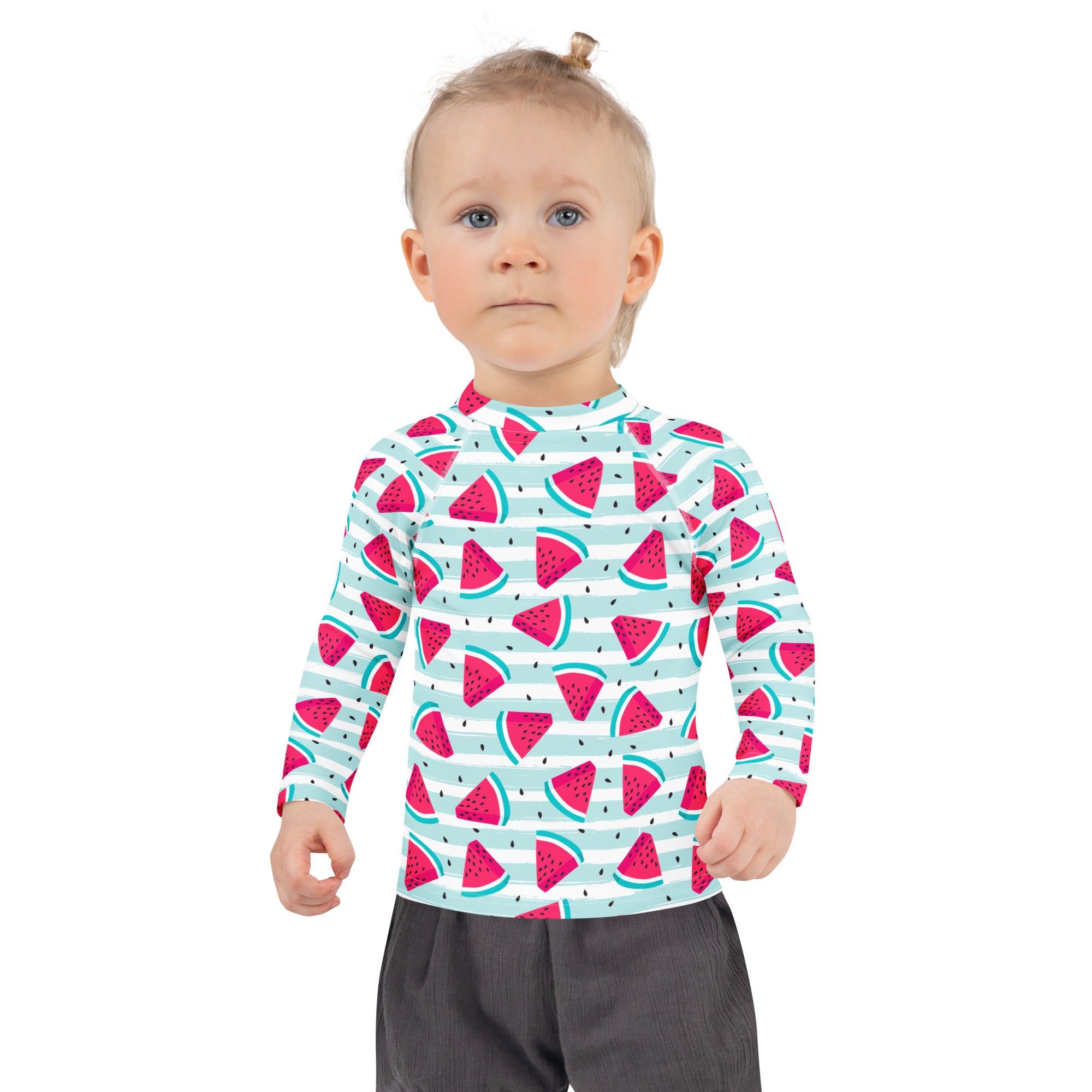 A child wearing a kids striped watermelon long sleeve rash guard swim shirt with upf 50 plus in light teal and white
