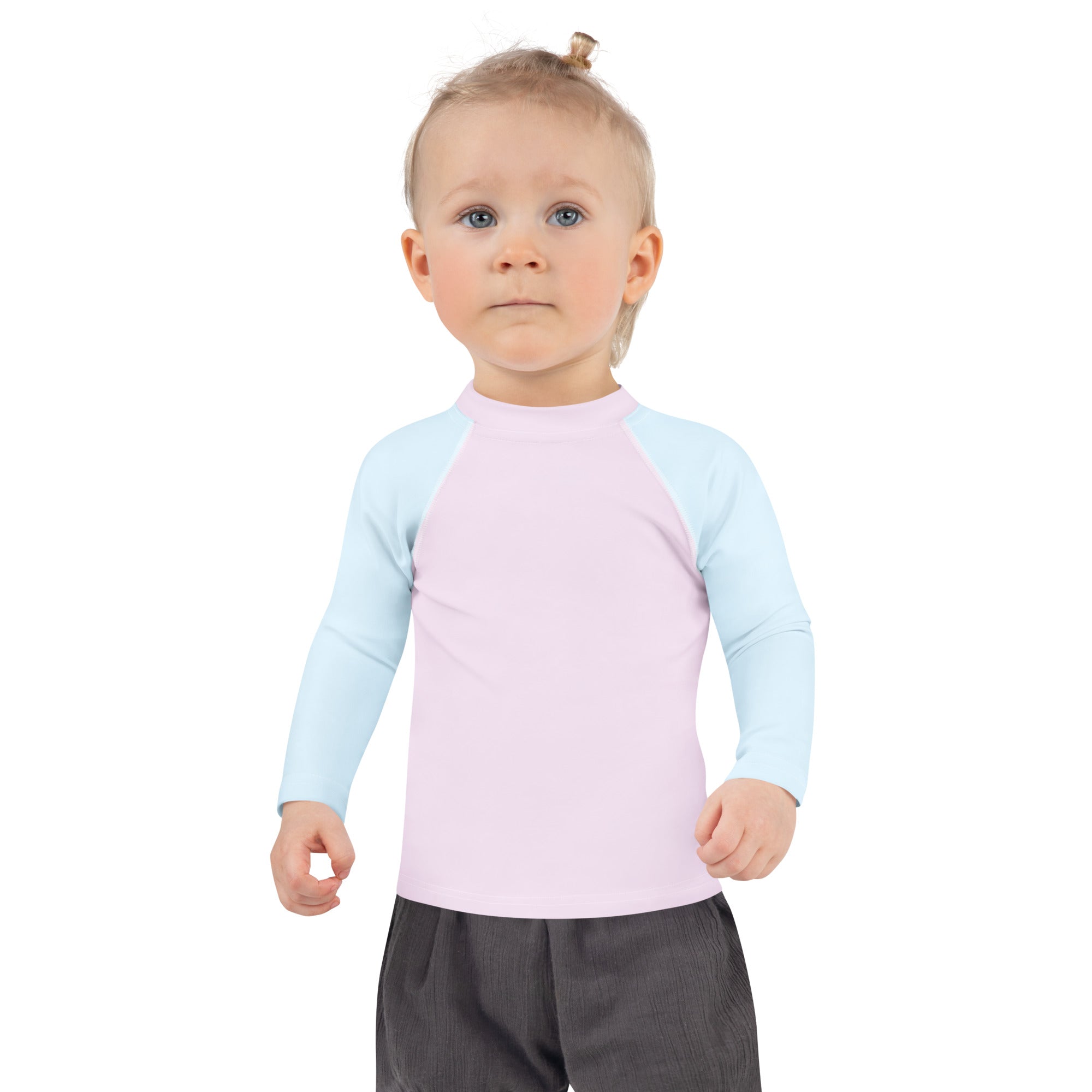 A child wearing a girls pink and blue cotton candy long sleeve rash guard swim shirt with upf 50 plus