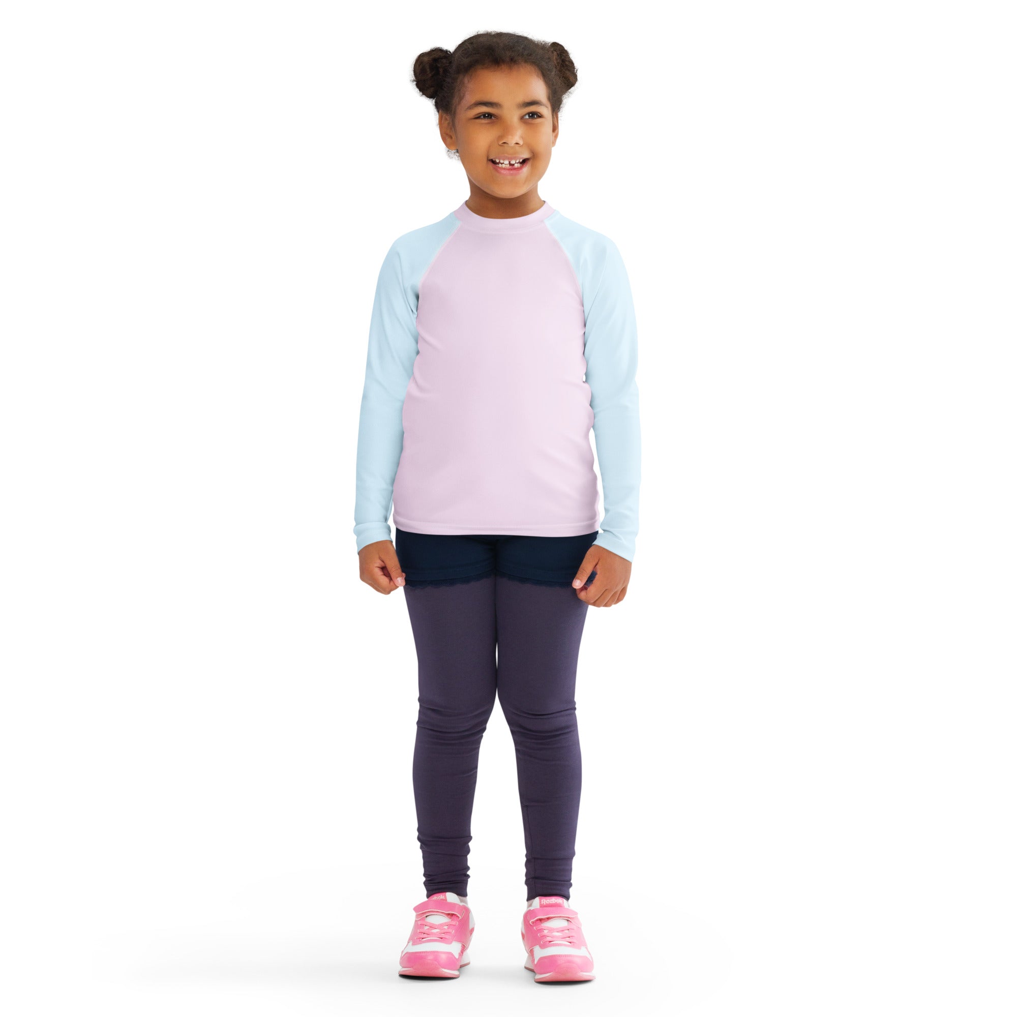 A child wearing a girls pink and blue cotton candy long sleeve rash guard swim shirt with upf 50 plus and dark leggings