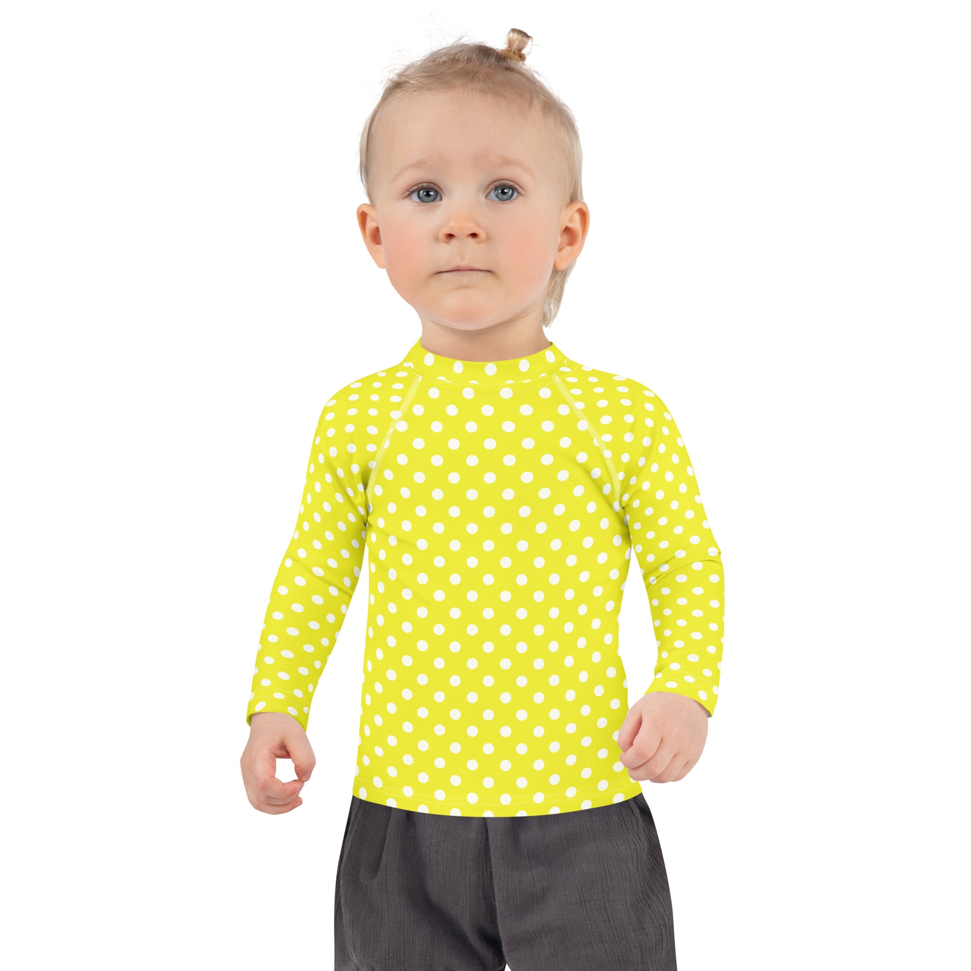 Kids yellow long sleeve rash guard swim shirt with white polka dots and UPF 50 plus sun protection