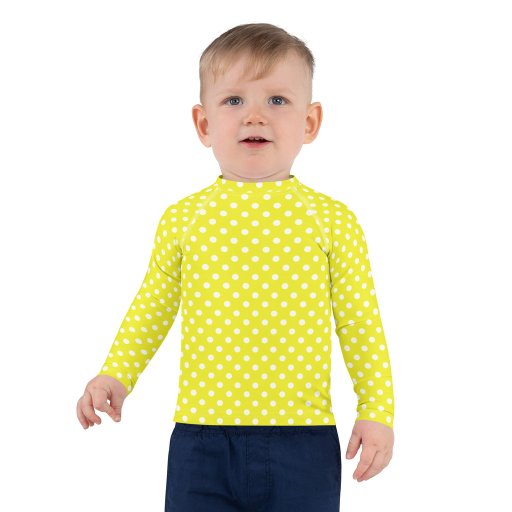 Kids yellow long sleeve rash guard swim shirt with white polka dots and UPF 50 plus for sun protection