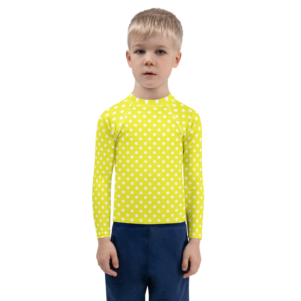 Kids yellow long sleeve rash guard swim shirt with white polka dots and upf 50 plus for sun protection
