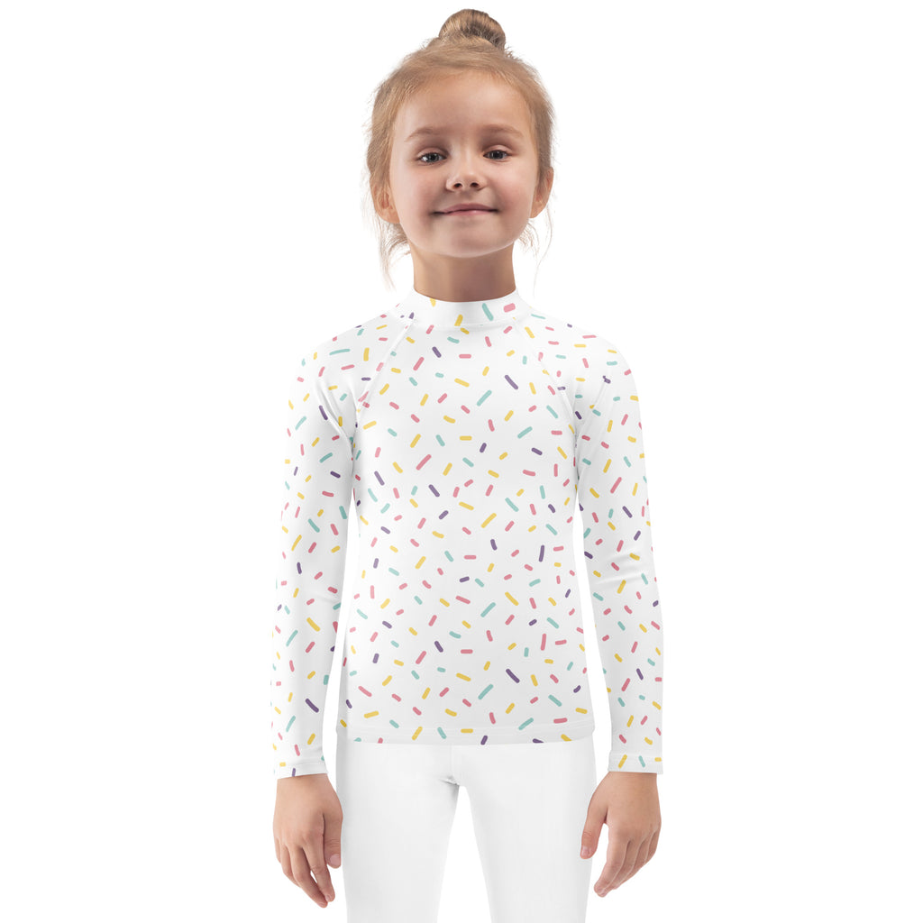 Kids colorful sprinkles long sleeve rash guard swim shirt in white with multicolored sprinkle pattern and upf 50+ protection