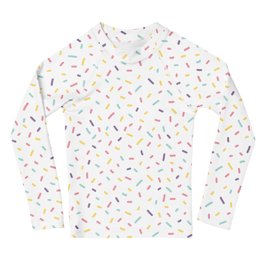 White kids long sleeve rash guard swim shirt with colorful sprinkles pattern and UPF 50 plus sun protection