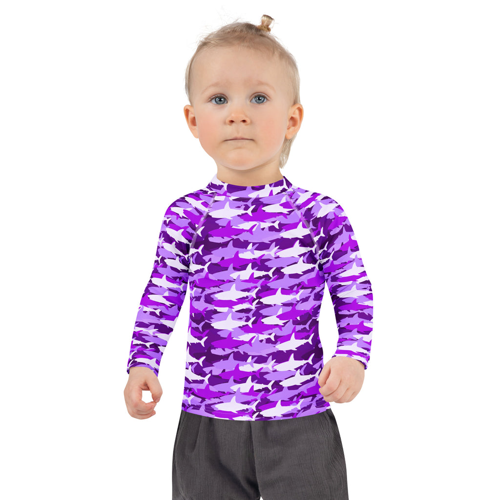 Girls purple and white shark-patterned long-sleeved rash guard swim shirt with upf 50 plus protection