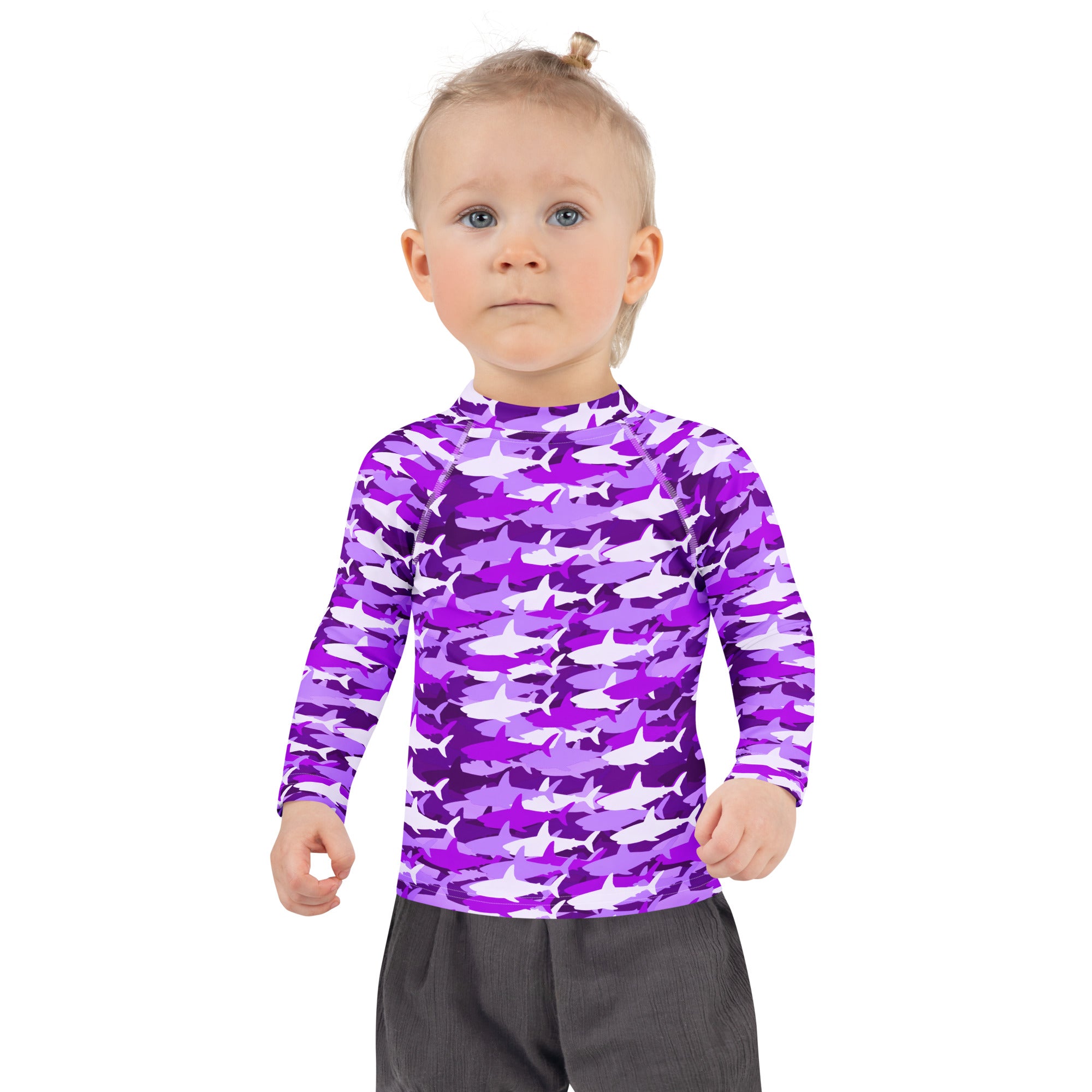 Girls purple and white shark-patterned long-sleeved rash guard swim shirt with upf 50 plus protection