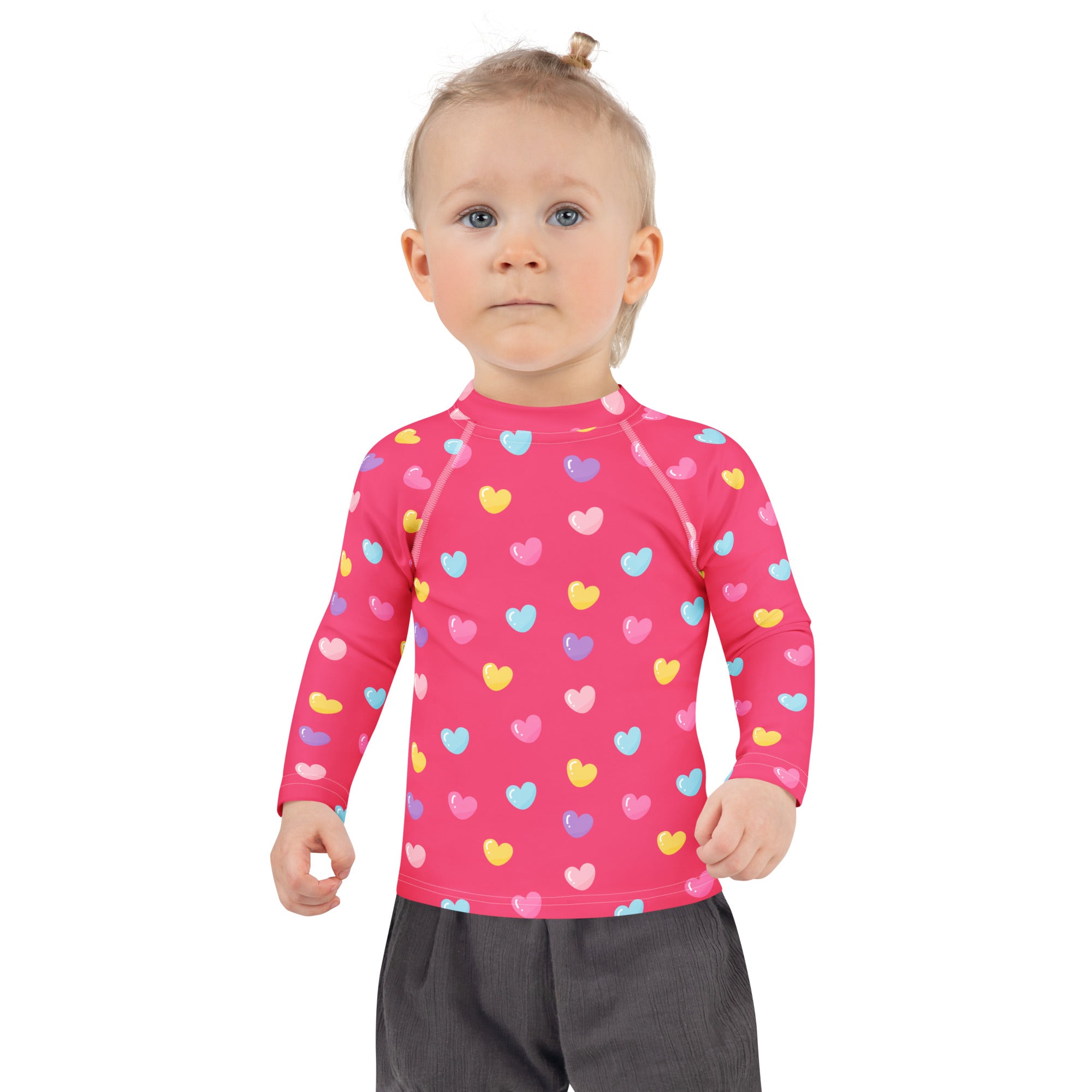 Girls colorful hearts pink long sleeve rash guard swim shirt with UPF 50 plus featuring multicolored heart pattern