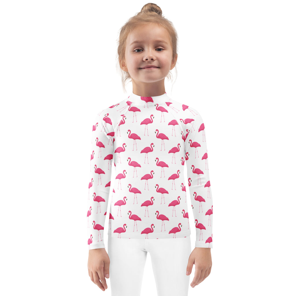 White long sleeve kids rash guard swim shirt with pink flamingo pattern and UPF 50 plus sun protection