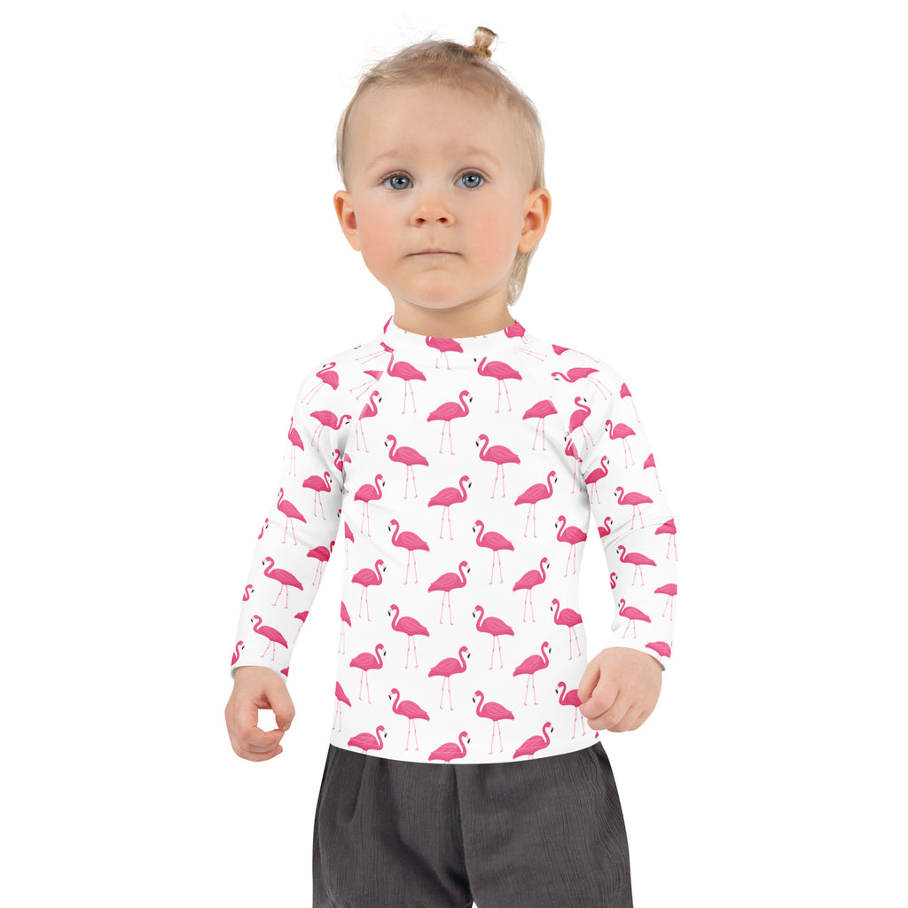 Kids pink flamingo long sleeve rash guard swim shirt in white with upf 50 plus for sun protection