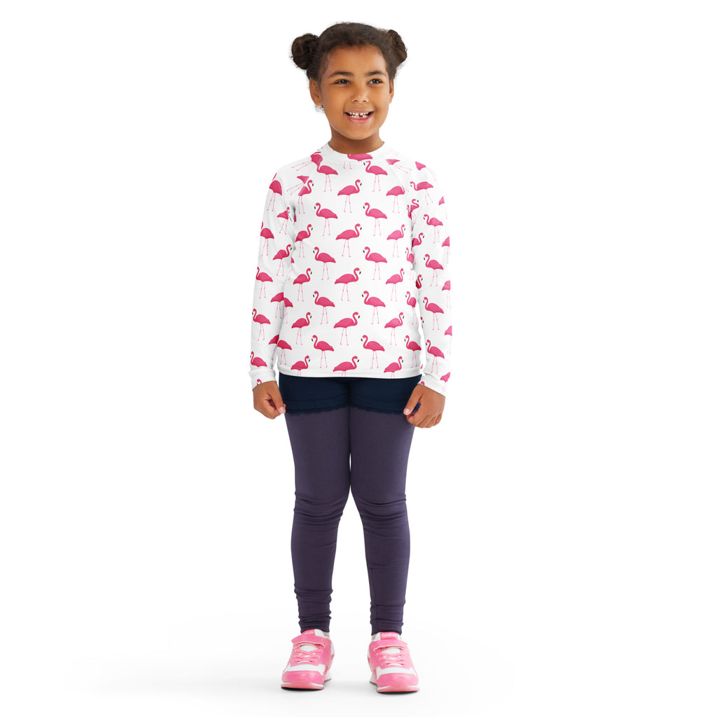 Kids pink flamingo long sleeve rash guard swim shirt in white with UPF 50 plus for sun protection