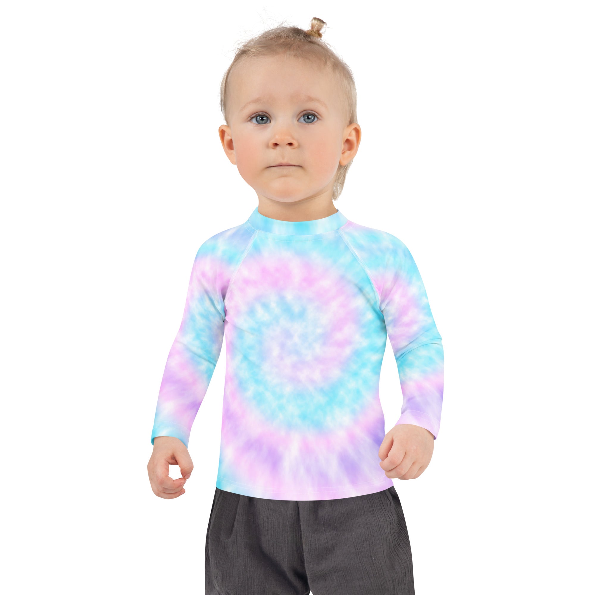 A child wearing a girl tie dye long sleeve rash guard swim shirt with upf 50 plus in pastel blue pink and purple
