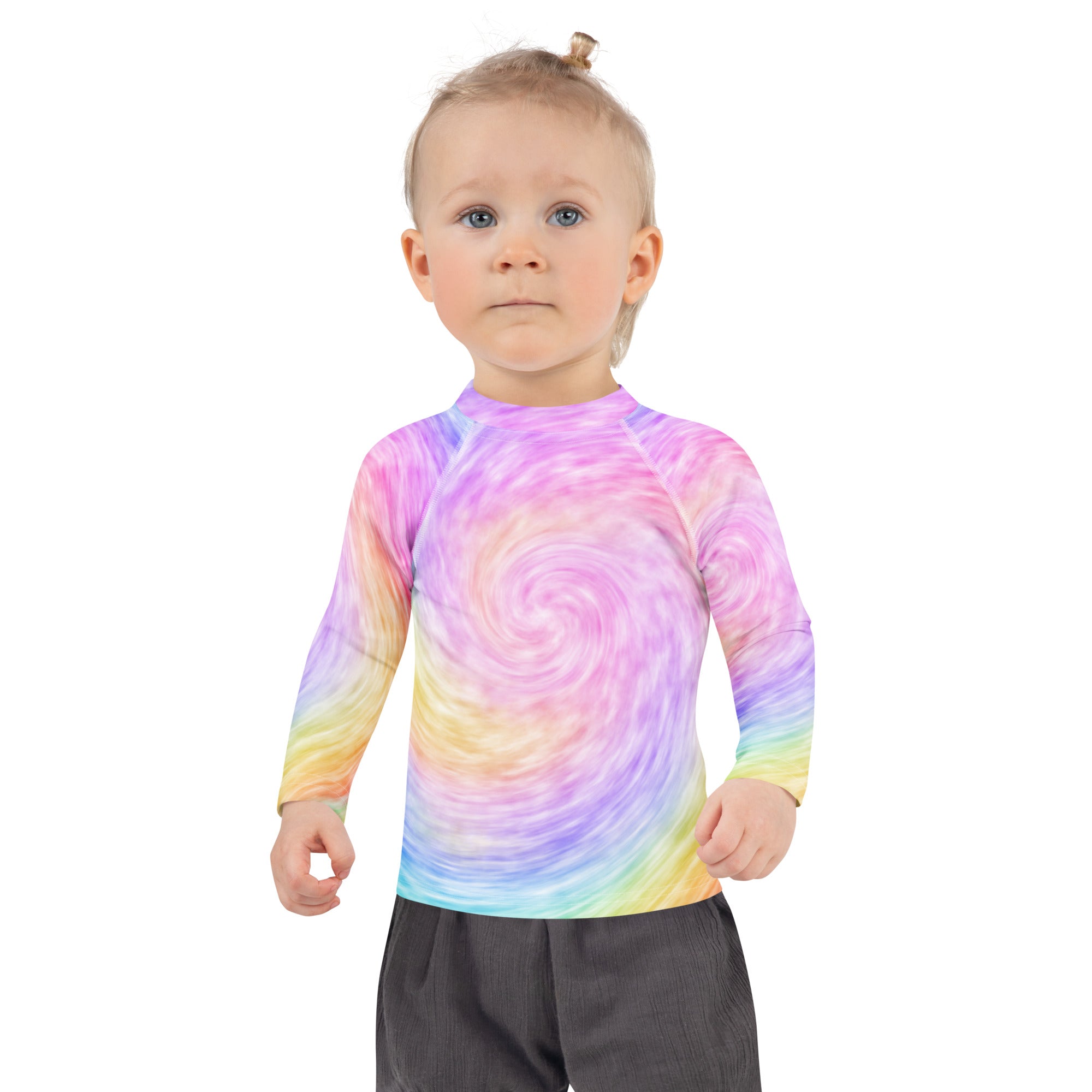 A child wearing a kids rainbow tie dye long sleeve rash guard swim shirt with UPF 50+ made of soft stretchy fabric