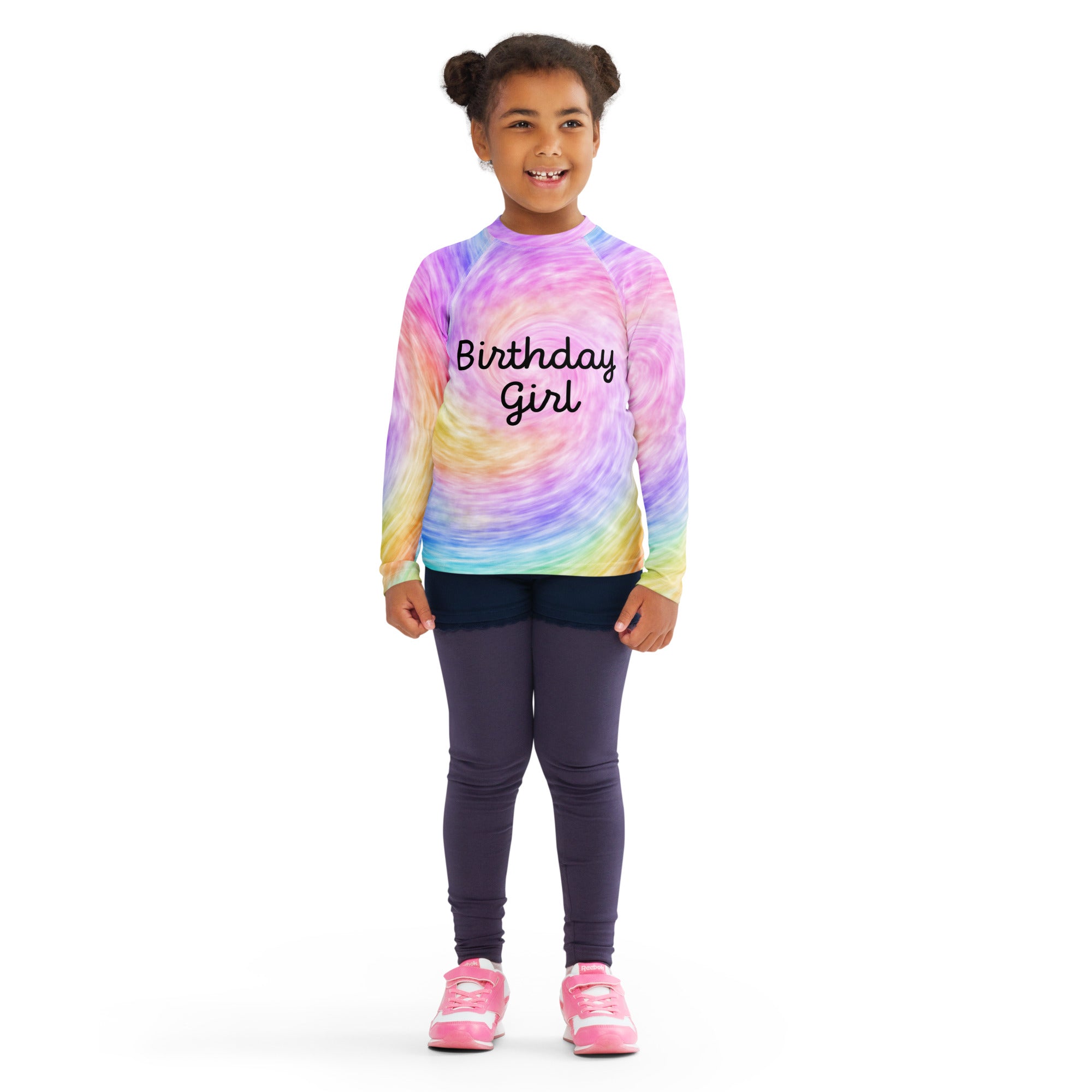 A vibrant rainbow tie dye girls long sleeve rash guard swim shirt with birthday girl print and UPF 50+ protection