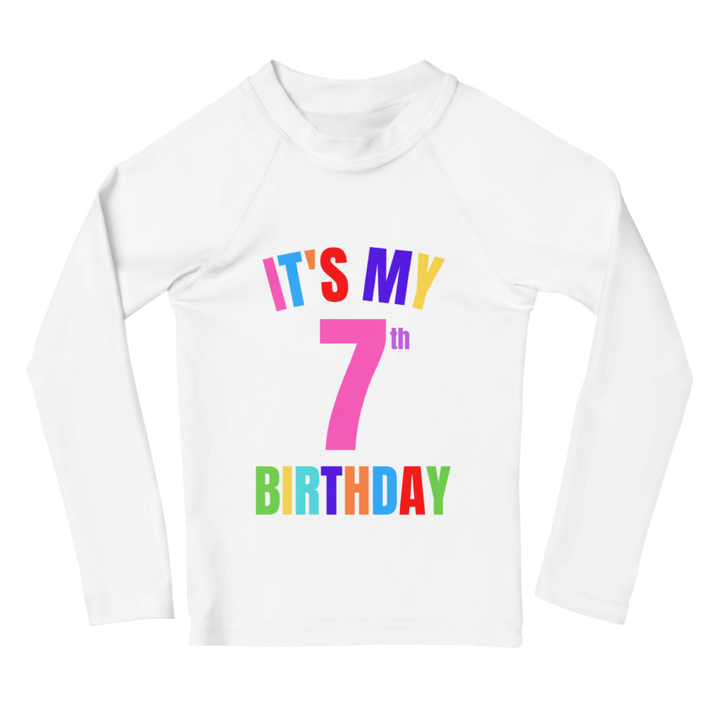 White long-sleeved kids rash guard swim shirt with colorful it is my 7th birthday text and UPF 50 plus protection