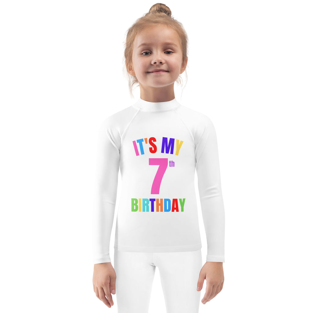 White long-sleeved rash guard swim shirt with colorful its my 7th birthday graphic and upf 50 plus protection