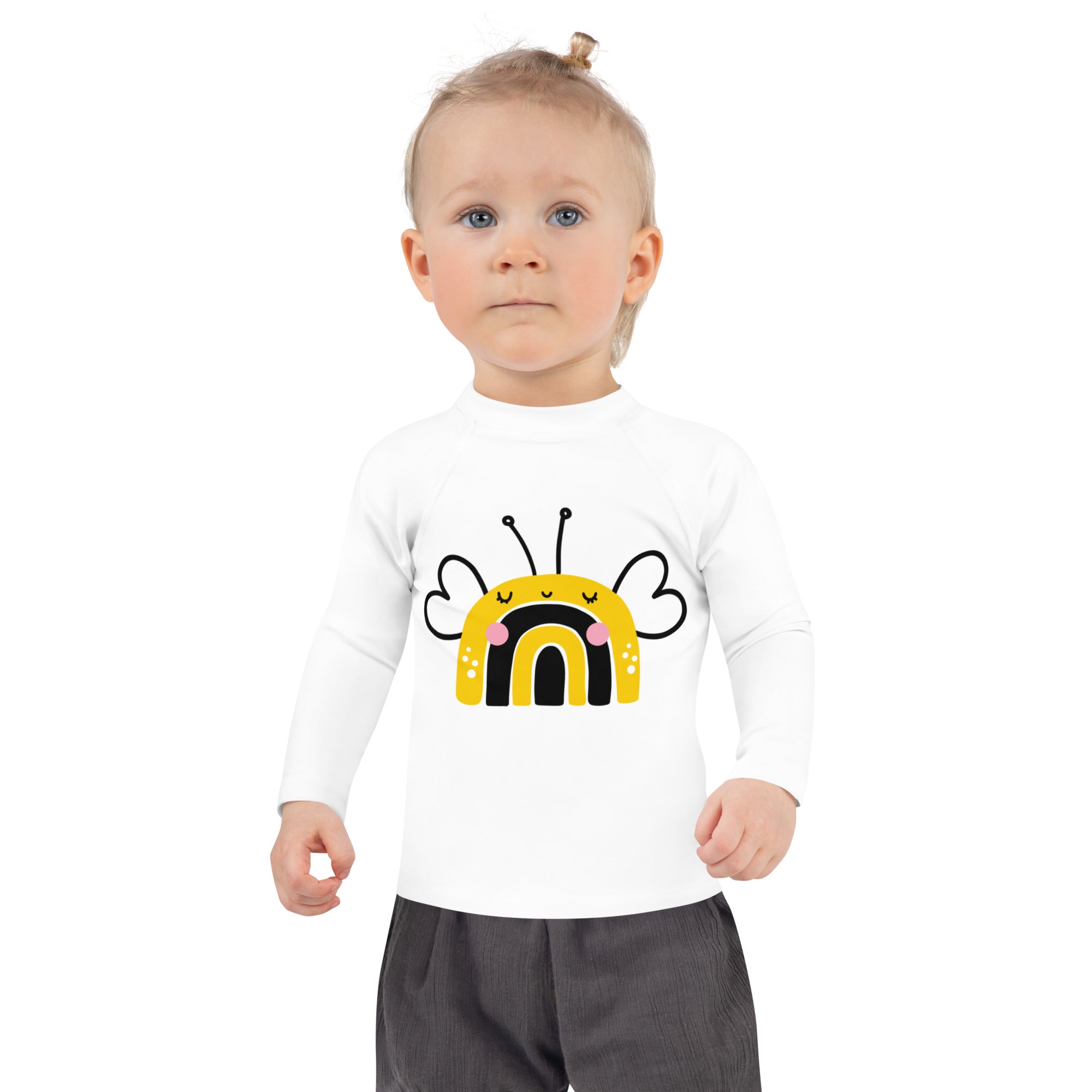 White long-sleeved toddler rash guard swim shirt with cheerful bee design pink cheeks rainbow wings upf 50+