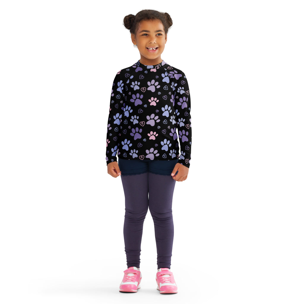 Black long-sleeved shirt with a playful pattern of purple and pink paw prints and hearts.
