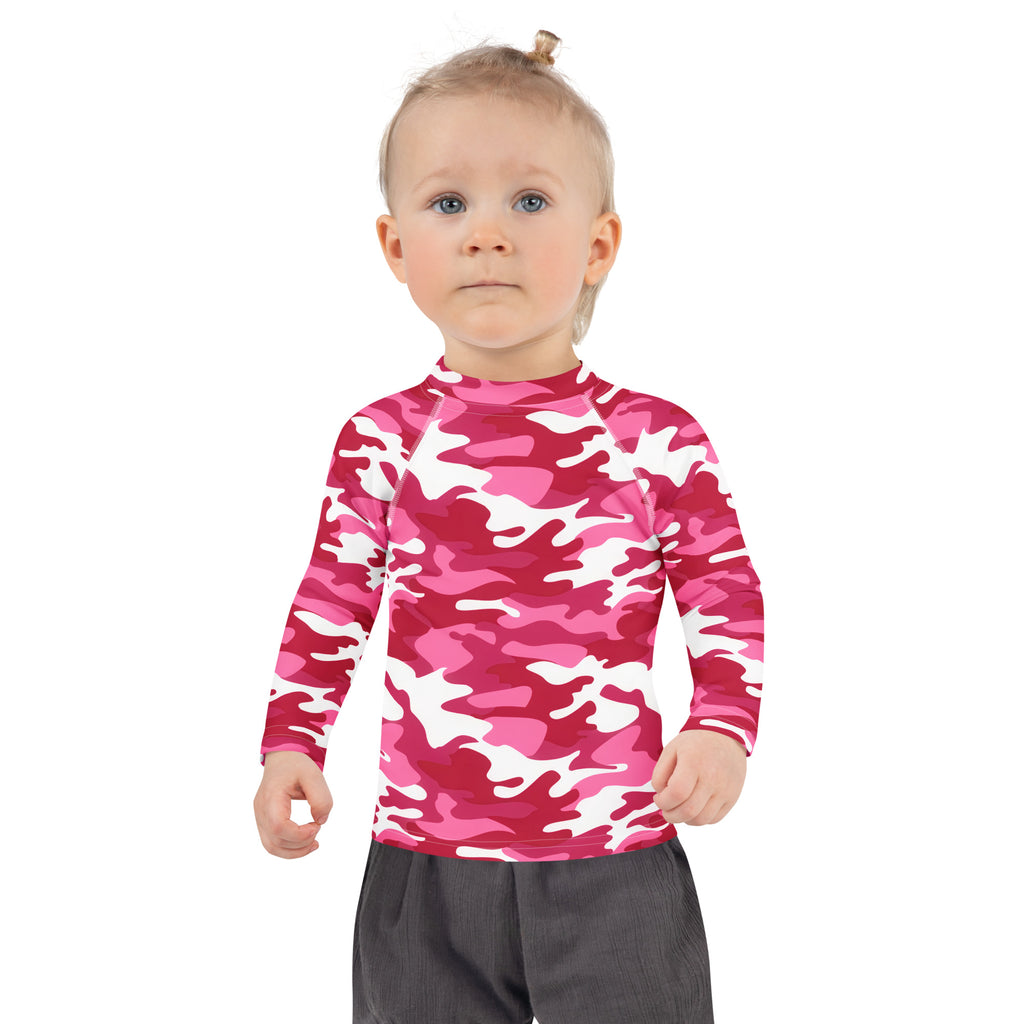 A child wearing a girls pink and white camouflage long sleeve rash guard with UPF 50 plus for sun protection
