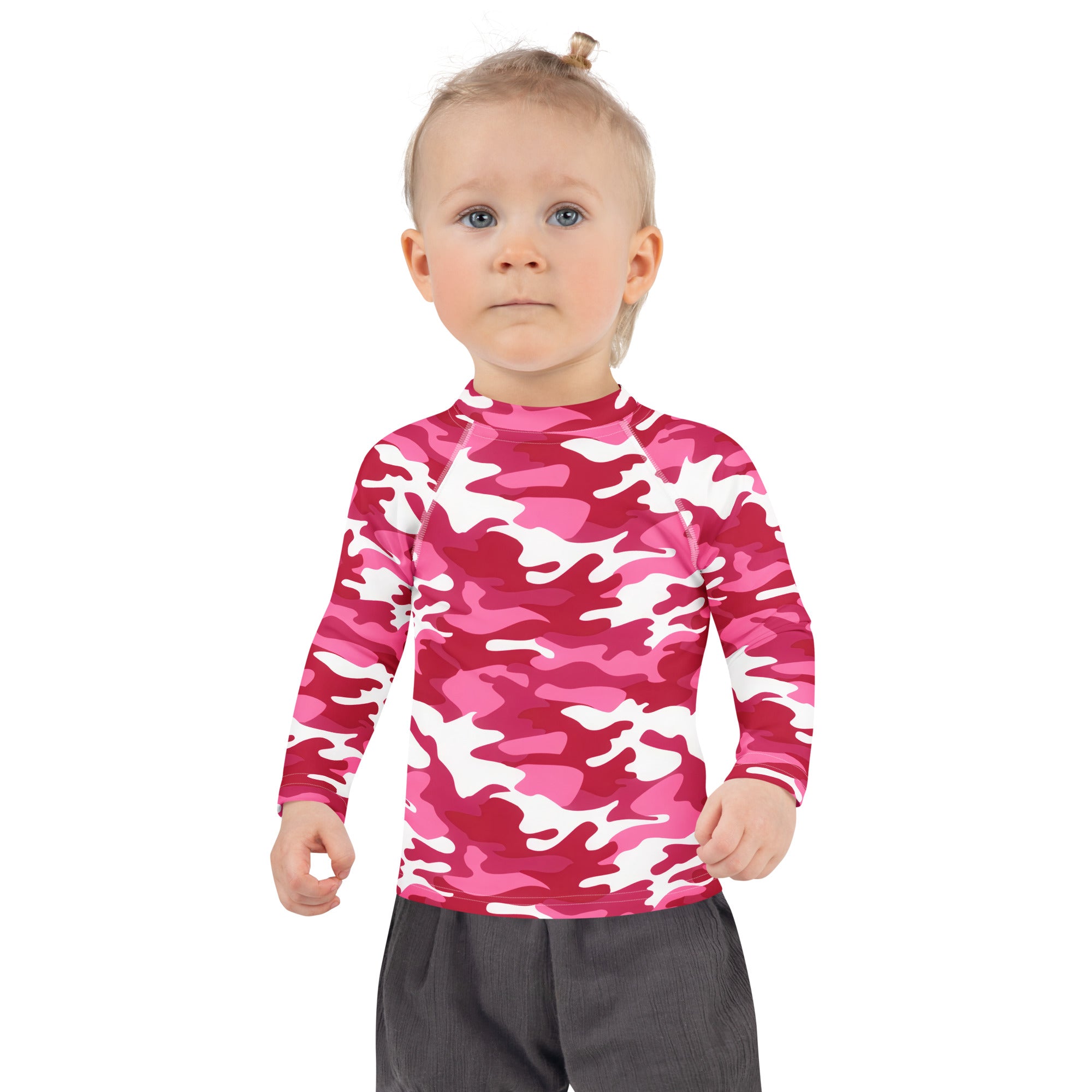A child wearing a girls pink and white camouflage long sleeve rash guard with UPF 50 plus for sun protection