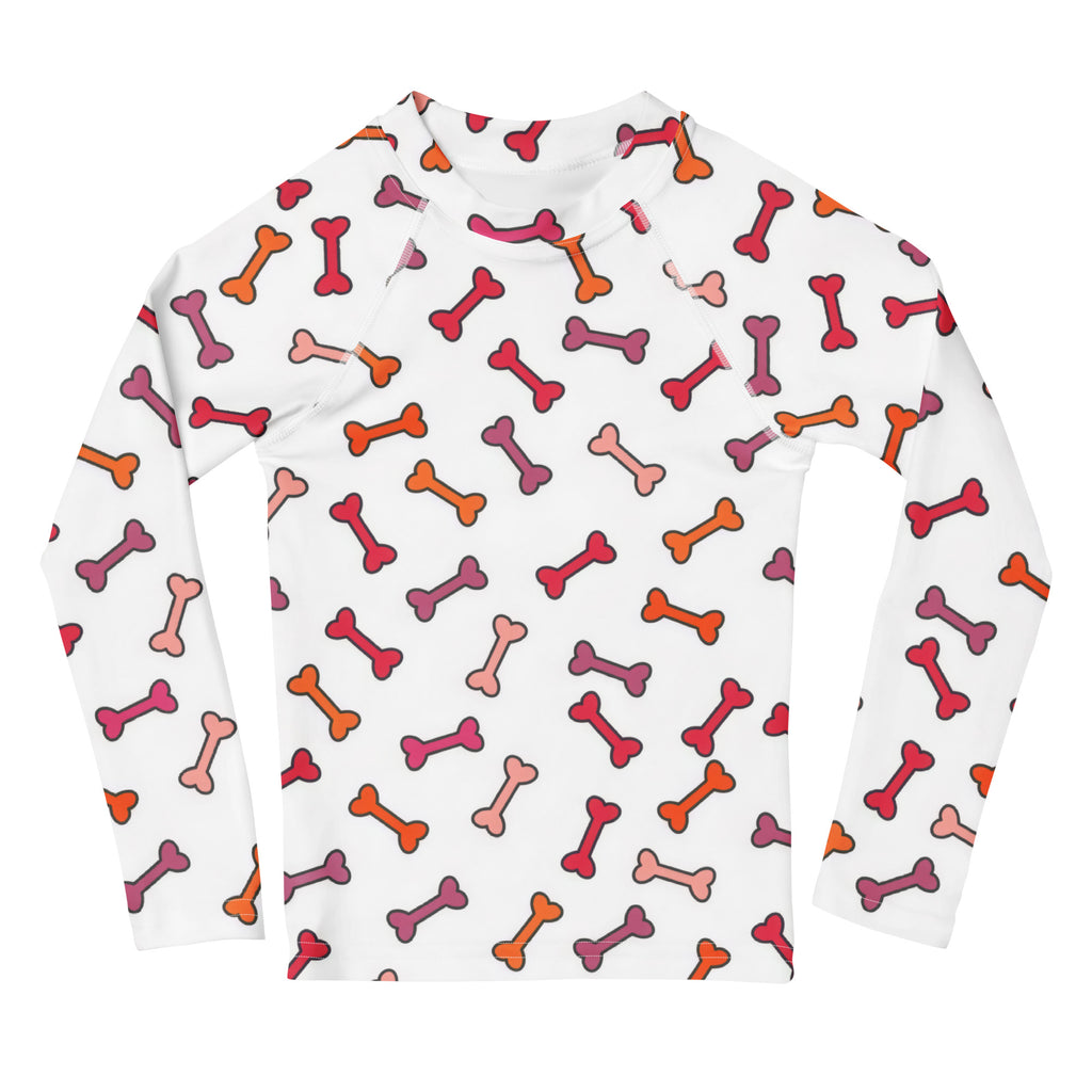 Kids dog bone long sleeve rash guard swim shirt in white with red orange and pink cartoon bone pattern and upf 50+ protection