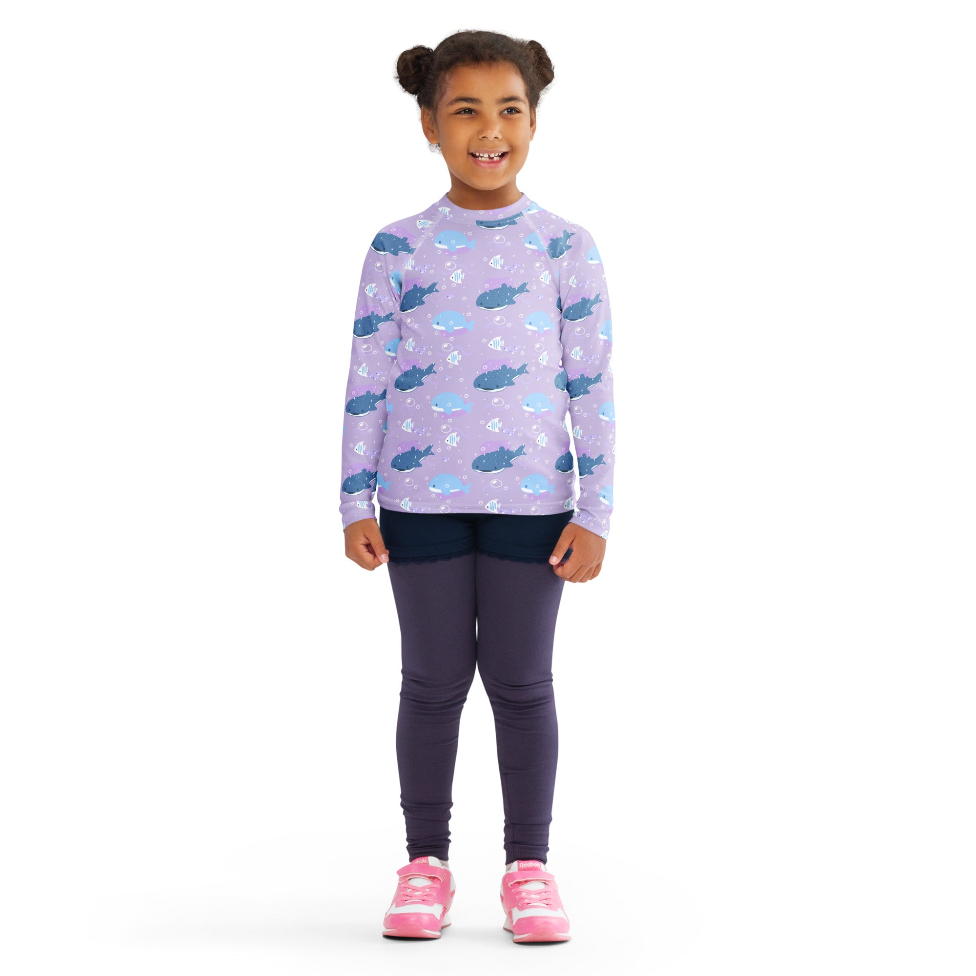 Girls purple long sleeve rash guard swim shirt with UPF 50 plus featuring a playful blue whale and fish pattern