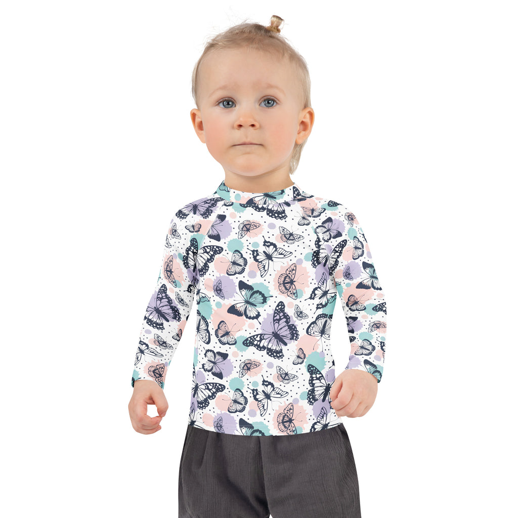 Girls butterfly long sleeve rash guard swim shirt with upf 50 plus featuring pastel butterfly pattern on white background