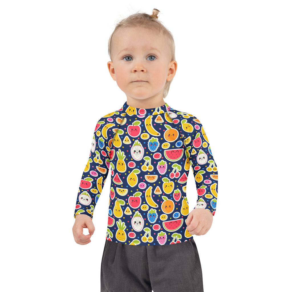 A navy blue kids long sleeve rash guard with colorful smiling fruit emojis and UPF 50 plus sun protection
