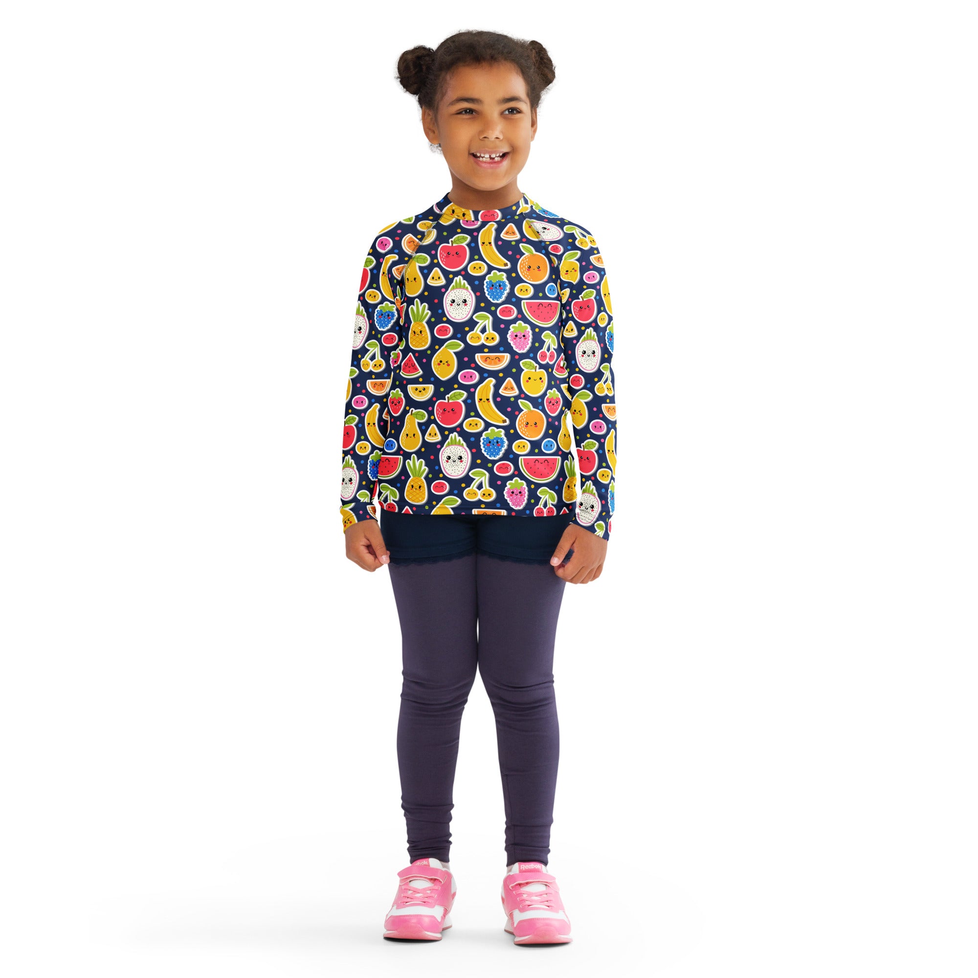 A child wearing a navy blue kids emoji fruit long sleeve rash guard swim shirt with UPF 50 and colorful print