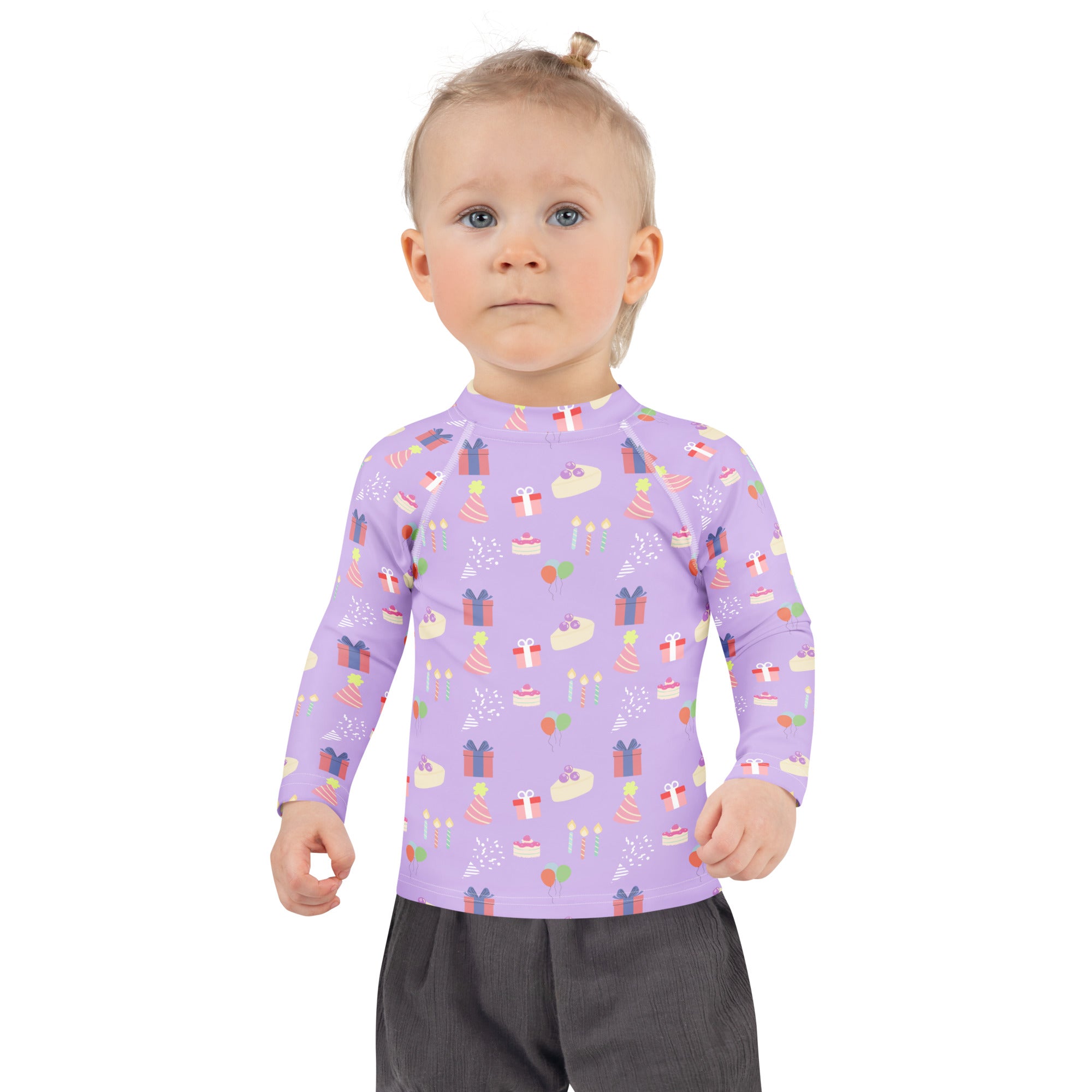 Girls purple long sleeve rash guard swim shirt with upf 50 plus featuring a playful birthday cake and gift pattern