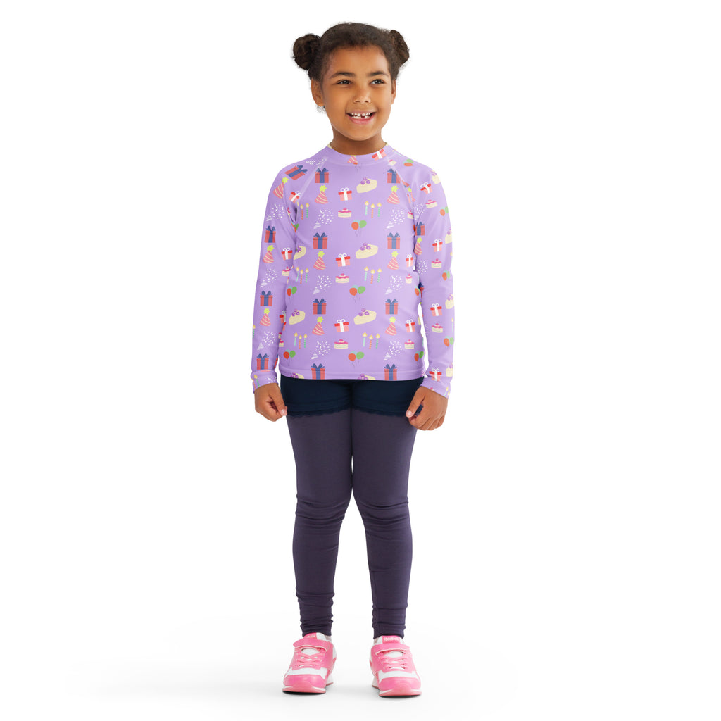Girls purple long sleeve rash guard swim shirt with birthday pattern and UPF 50 plus for sun protection