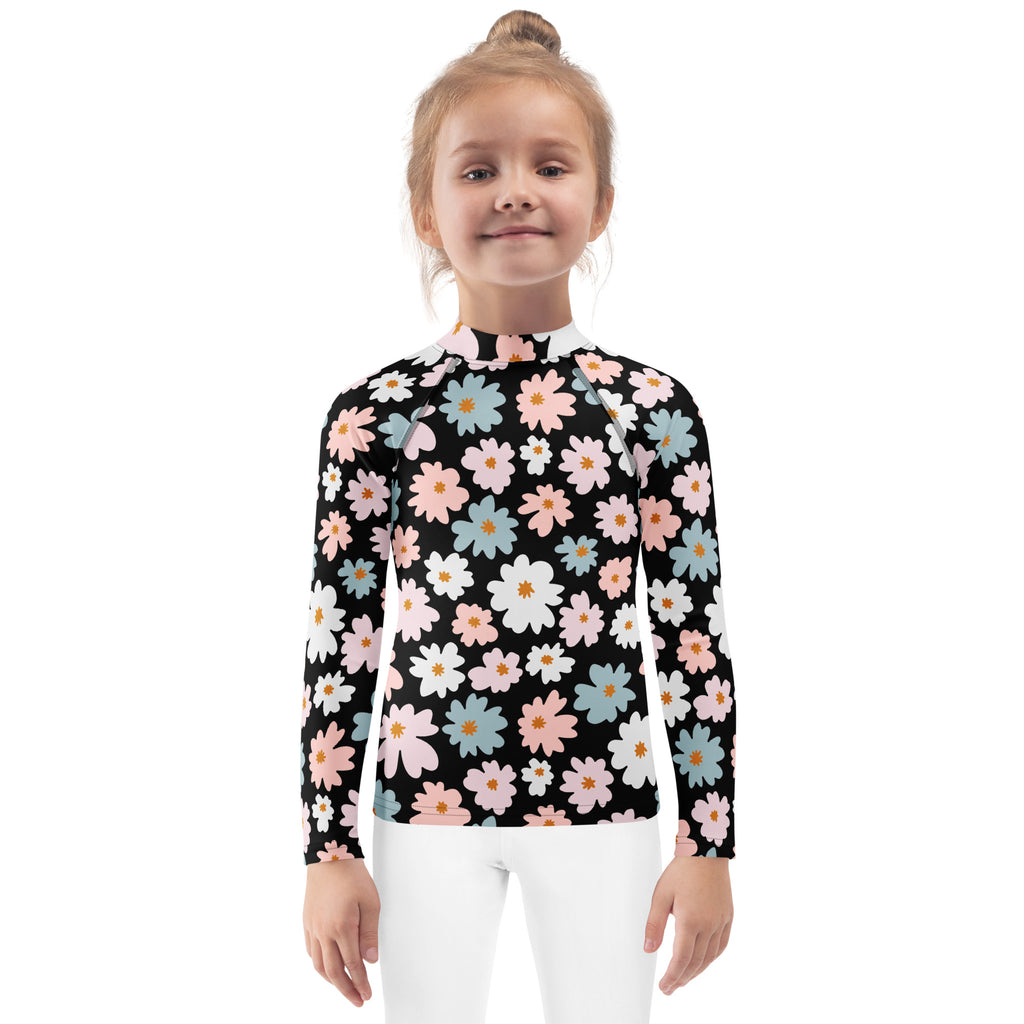 Black long sleeve girls rash guard swim shirt with pink white and blue daisies and upf 50 plus sun protection