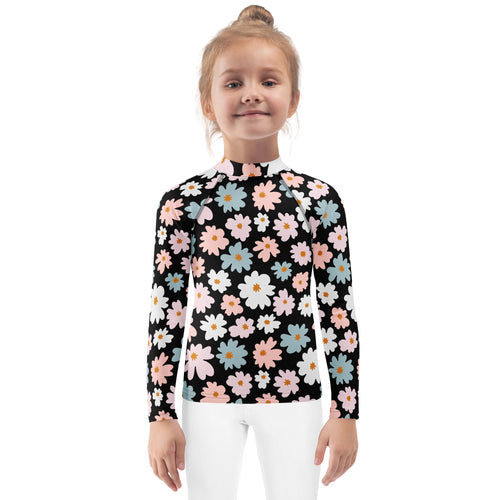 Black long sleeve girls rash guard swim shirt with pink white and blue daisies and upf 50 plus sun protection