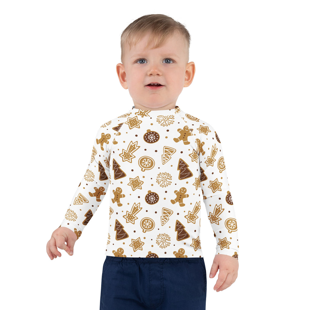 White long-sleeved kids rash guard swim shirt with festive gingerbread pattern and upf 50 plus protection