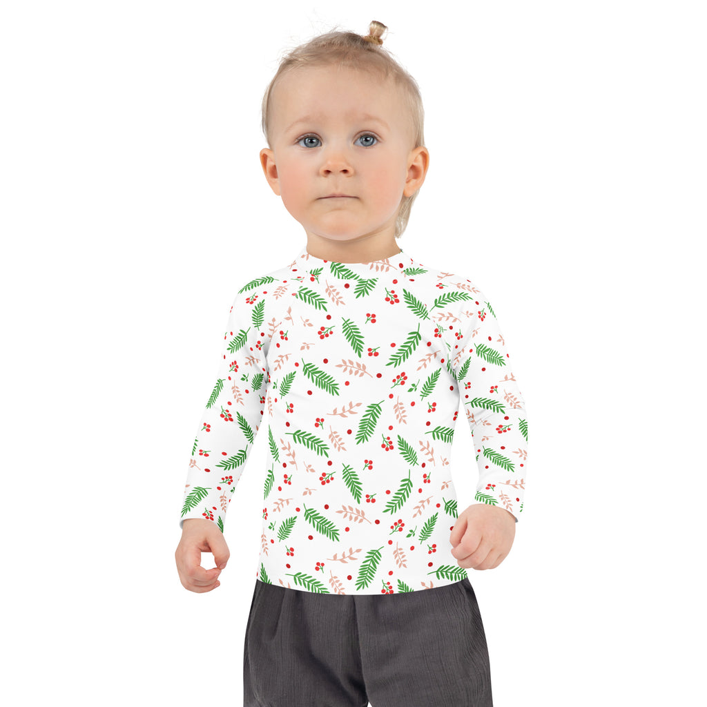 Kids holly and evergreen christmas long sleeve rash guard swim shirt with upf 50 plus in white with green ferns and red berries