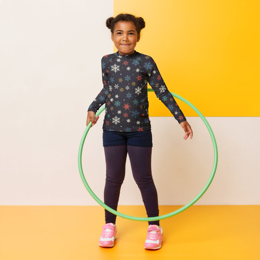 Green plastic hula hoop displayed with kids colorful snowflakes long sleeve rash guard swim shirt with upf 50+