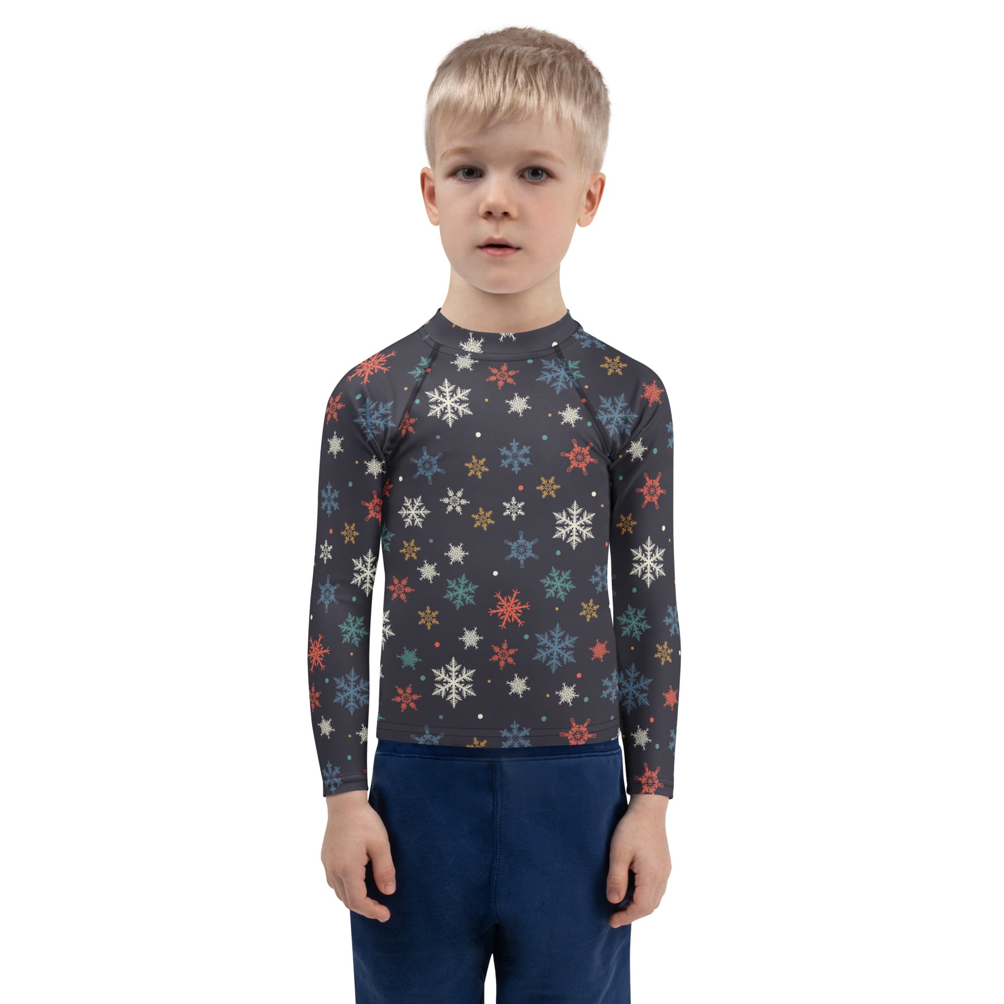 A child wearing a dark gray kids colorful snowflakes long sleeve rash guard swim shirt with UPF 50+ protection