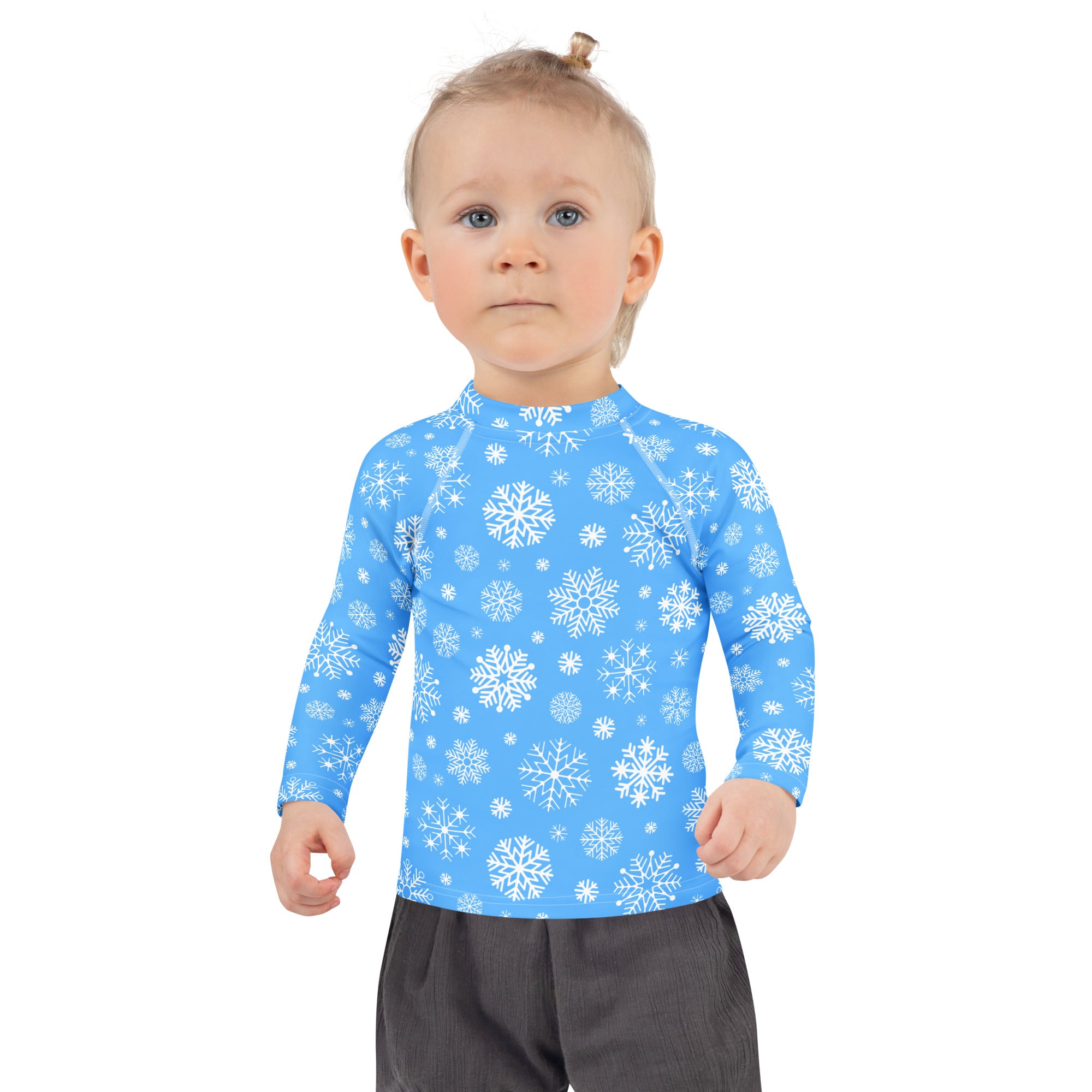 Kids blue long sleeve rash guard swim shirt with white snowflake pattern and UPF 50 plus sun protection