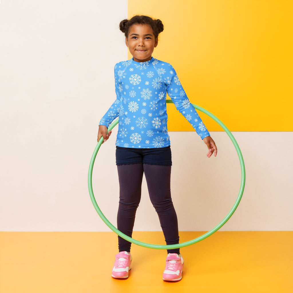 Green plastic hula hoop shown with kids blue snowflake long sleeve rash guard swim shirt with upf 50 plus
