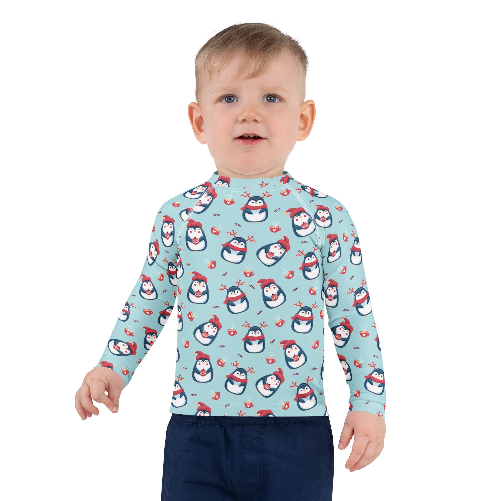 Kids reindeer penguin christmas long sleeve rash guard swim shirt in light blue with cartoon penguins and upf 50+ protection