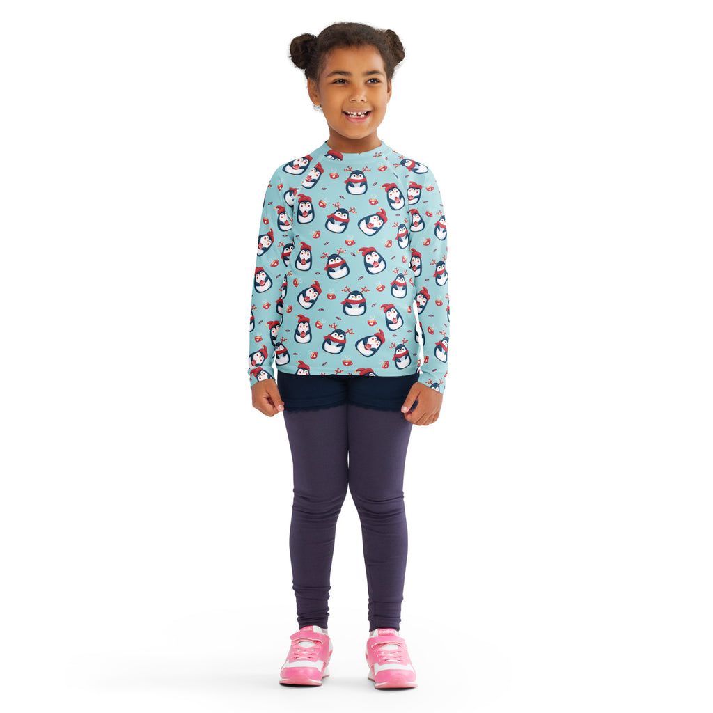 Kids reindeer penguin christmas long sleeve rash guard swim shirt in light blue with cartoon penguins holding hearts and upf 50+