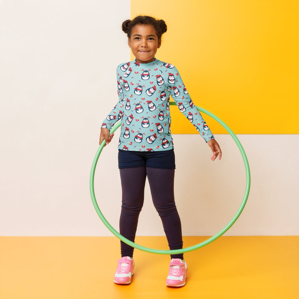 Green plastic hula hoop shown with kids reindeer penguin christmas long sleeve rash guard swim shirt with upf 50 plus