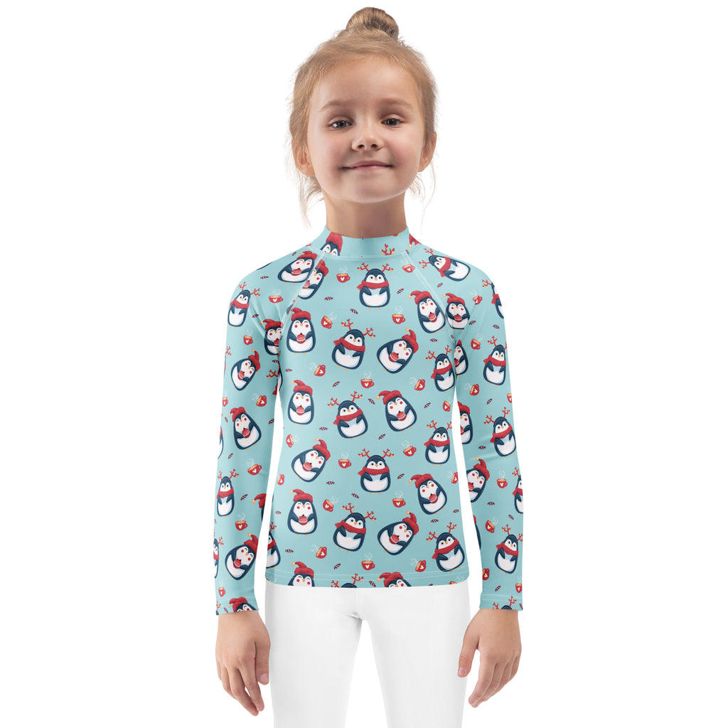 Kids reindeer penguin christmas long sleeve rash guard swim shirt in light blue with playful penguin and heart pattern and upf 50+