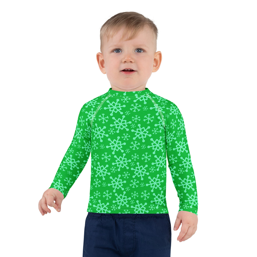 Kids green snowflake christmas long sleeve rash guard swim shirt with light mint snowflake pattern and UPF 50+ protection