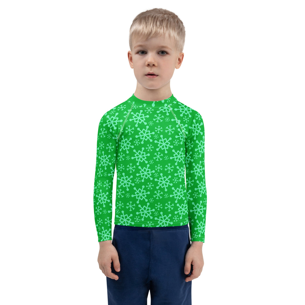 Kids green long sleeve rash guard swim shirt with mint snowflake pattern and UPF 50 plus sun protection